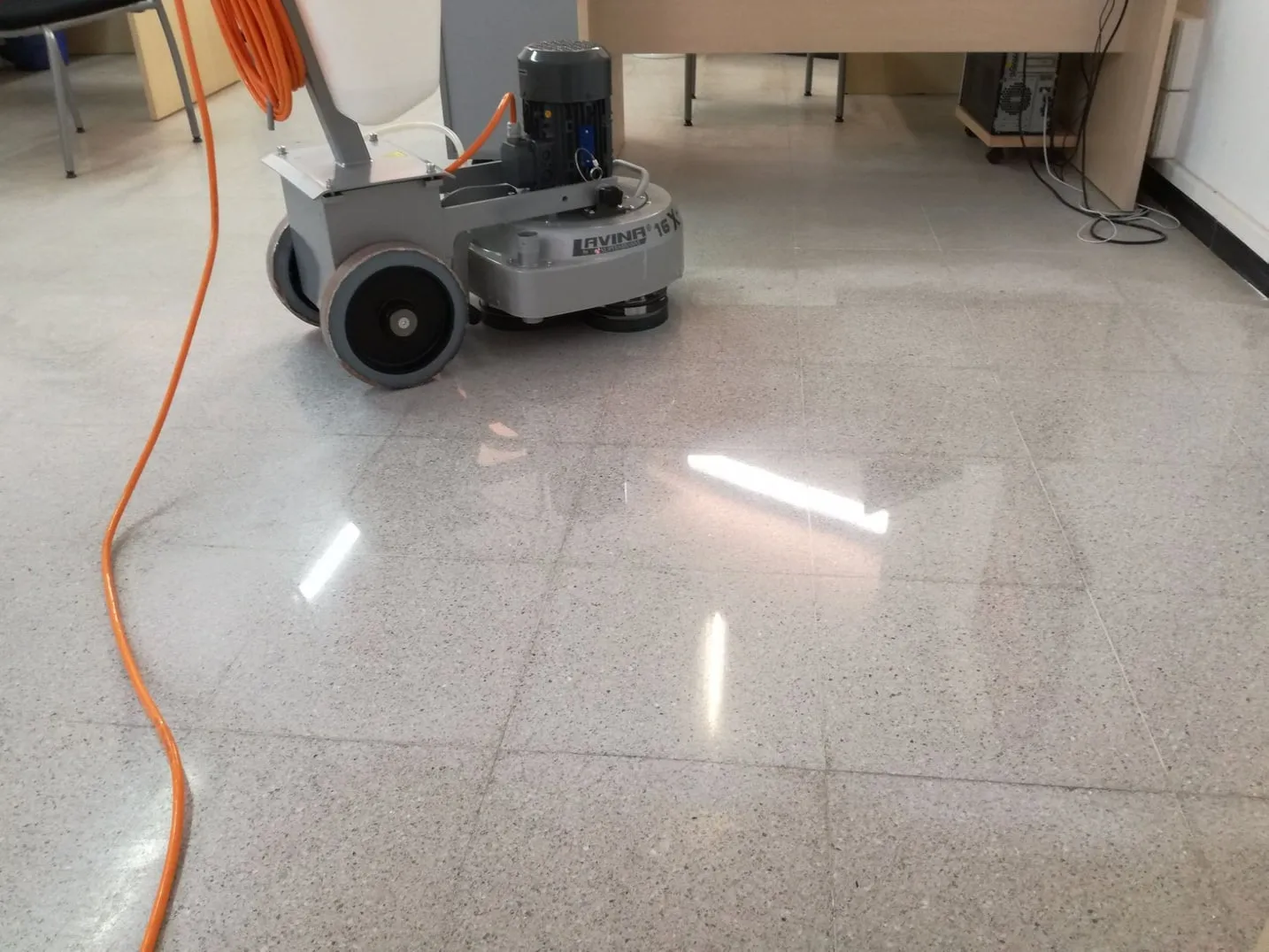 Single-disc machine on a terrazzo floor